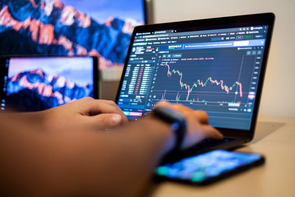 Trader reviewing crypto arbitrage opportunities on a laptop
